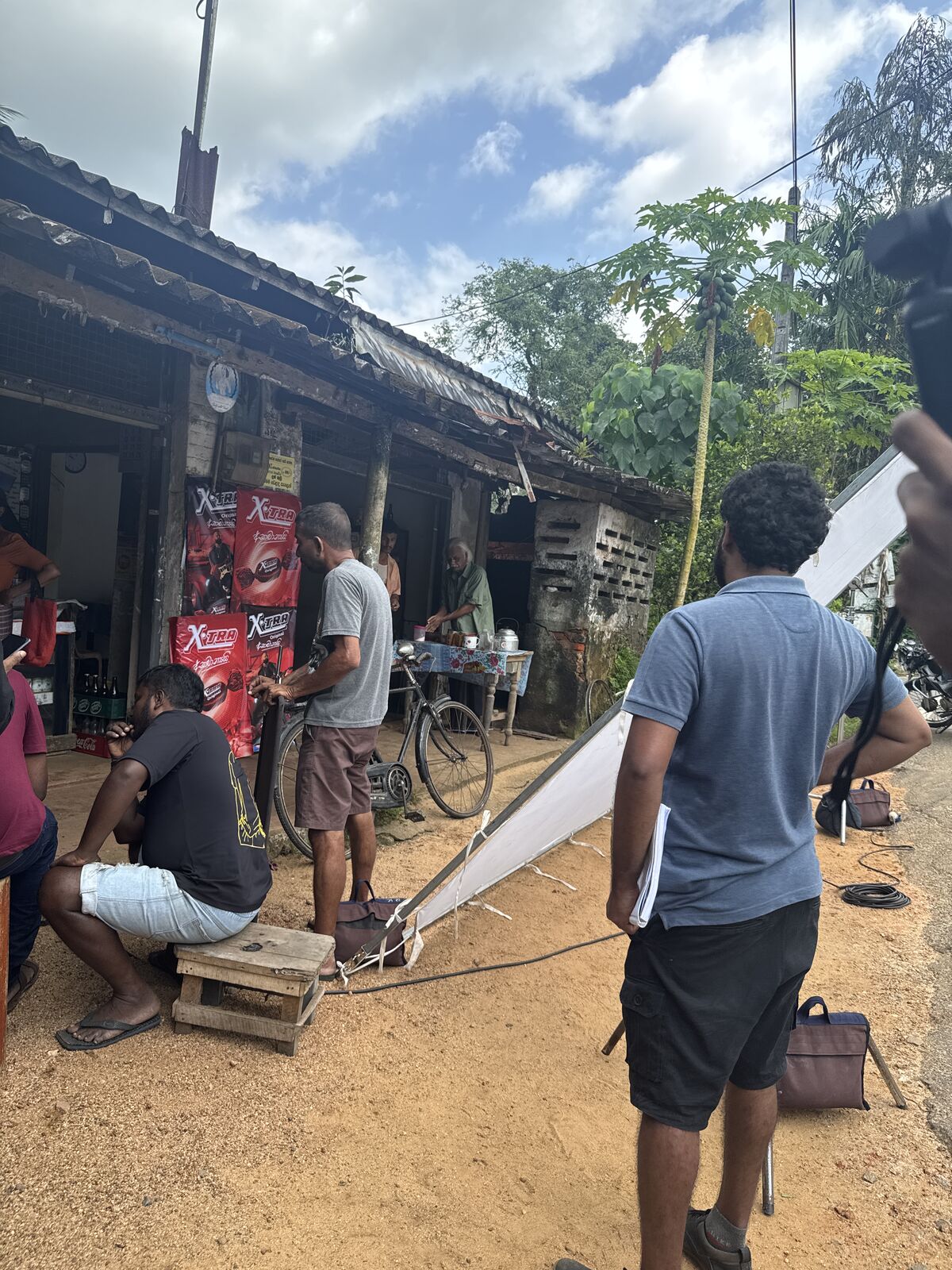 Crew member framing a shot during a teledrama shoot