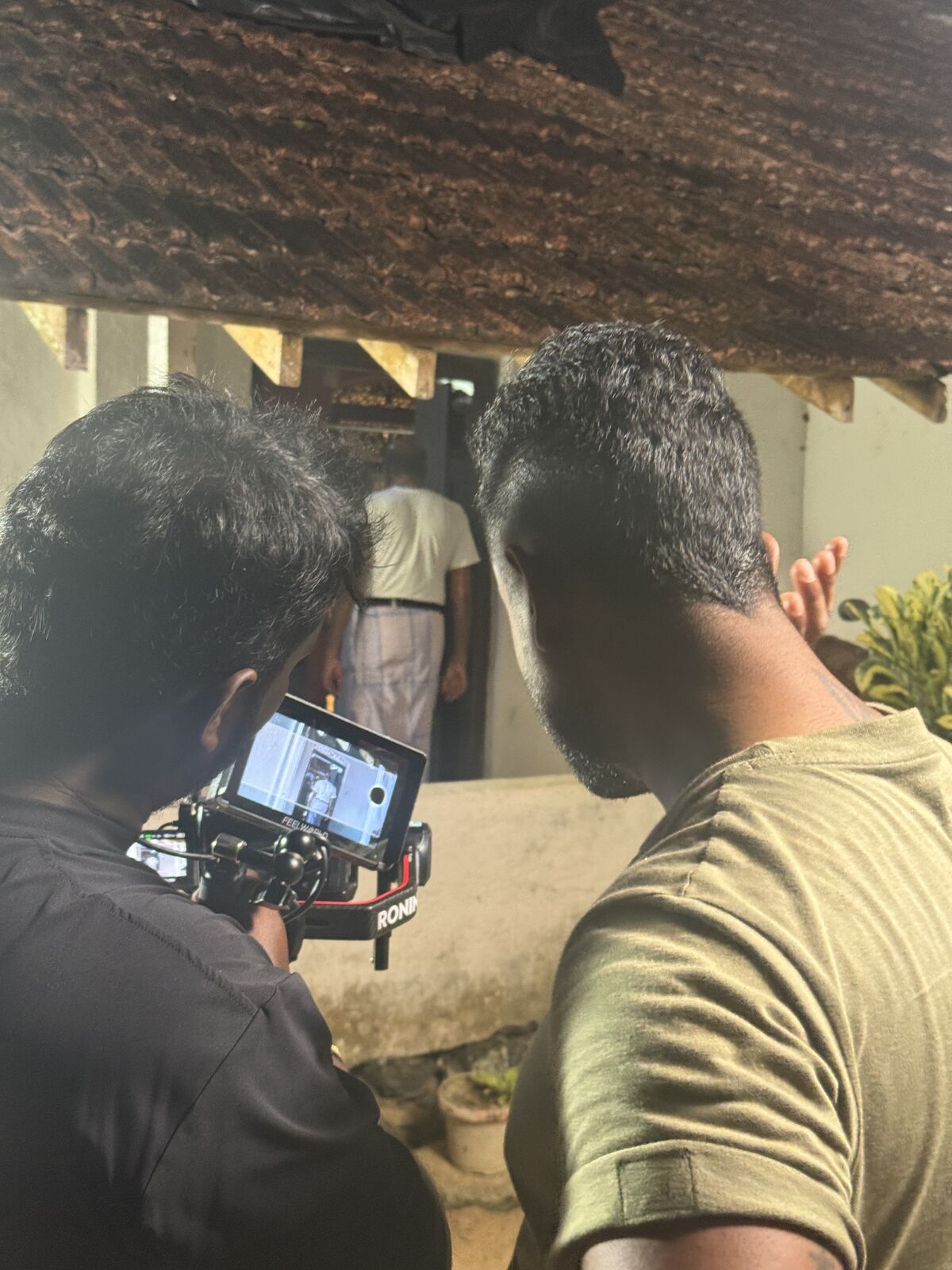Camera operator preparing a shot on location