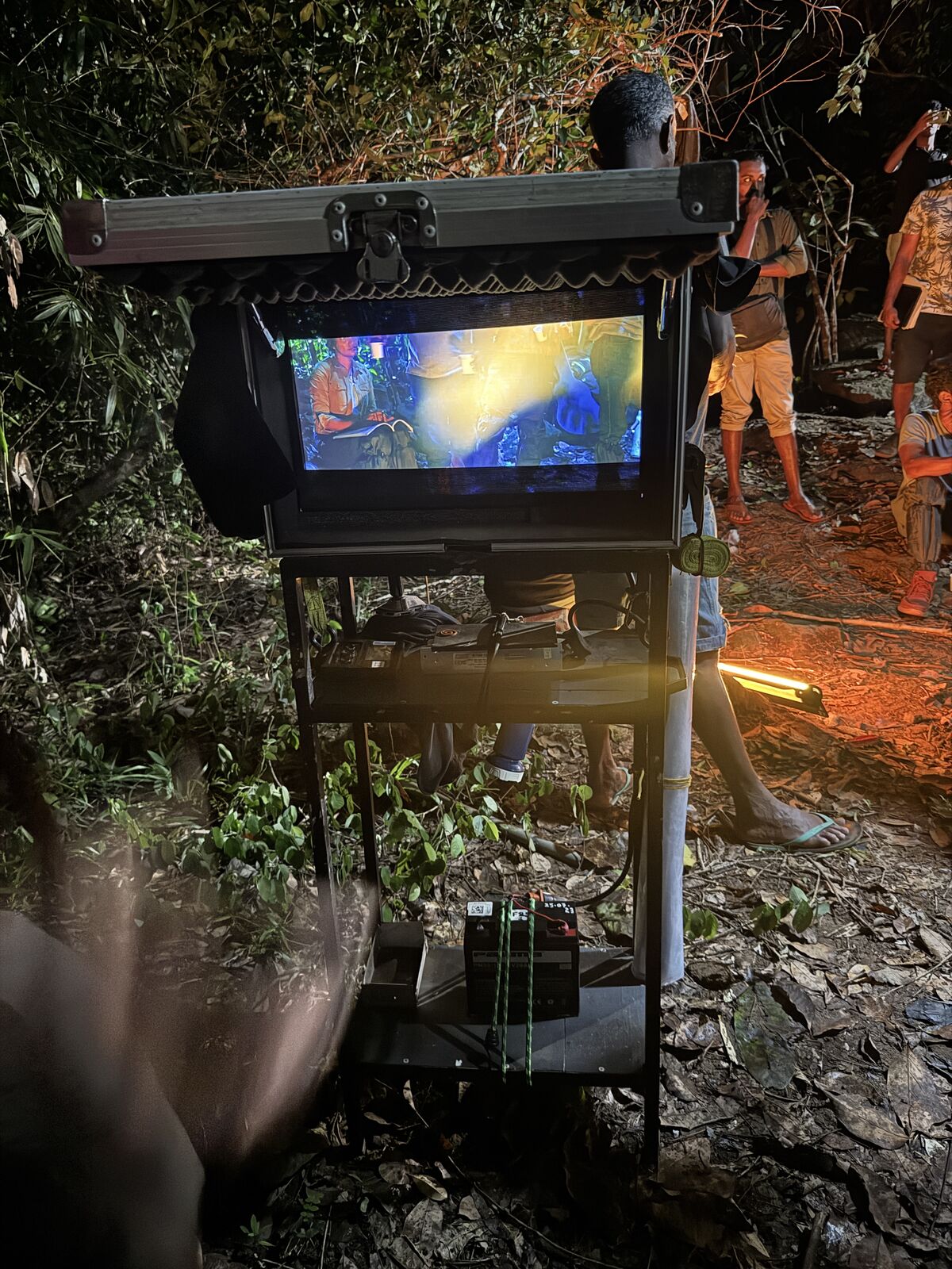 On-location production setup with camera and lighting gear